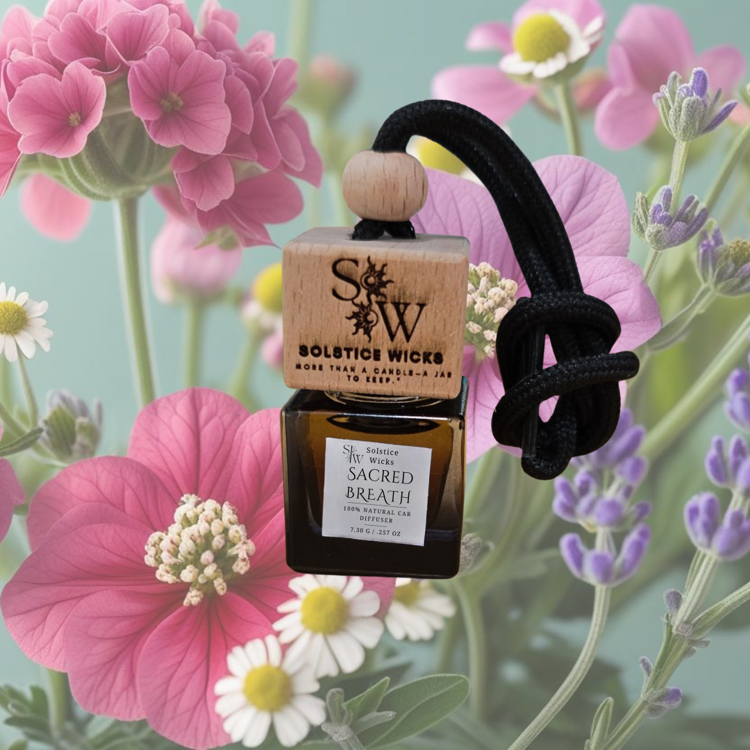 Hanging car diffuser labeled “Sacred Breath” with eucalyptus leaves, rosemary sprigs, lemon slices, and frankincense resin — fresh and purifying essential oil blend for cars.