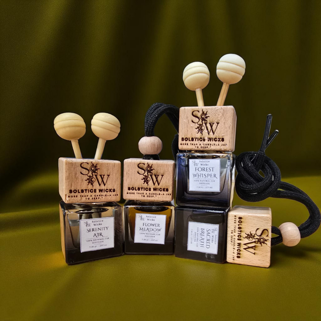Assorted  car diffusers with wood caps and ropes, featuring essential oil blends like lavender, eucalyptus, chamomile, and citrus — natural car aromatherapy.
