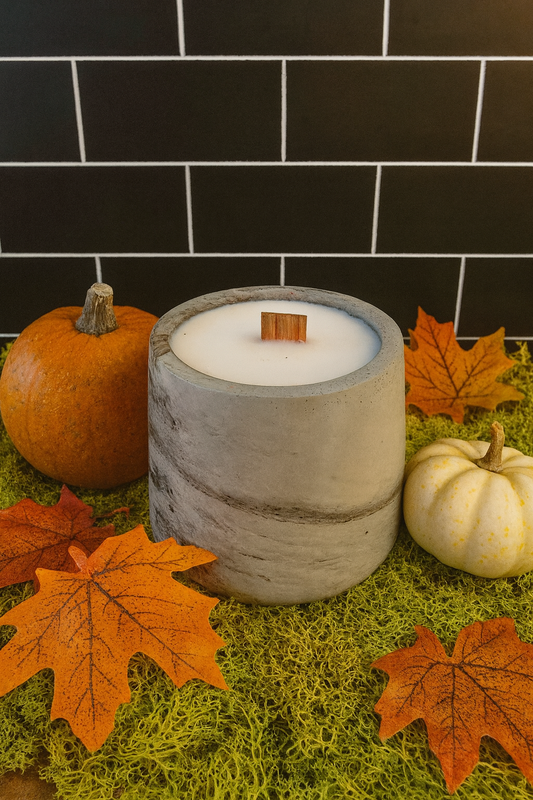 Harvest Treat Candle – warm apple, cinnamon, caramel scent in concrete jar with cotton accent and seasonal seed packet.