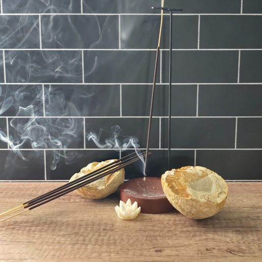 Six bundles of handcrafted incense sticks with natural botanicals representing each scent.